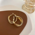 Twisted Ridged Hoop Earrings with Sculpted Polished Metal Details view 4