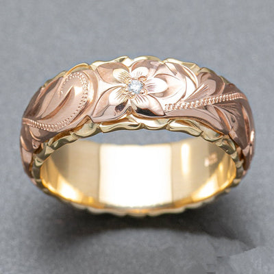 Product view showing rose and gold-tone sculpted floral wide band ring