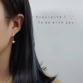 Gold Star and Crescent Moon Huggie Hoop Drop Earrings Pair view 2