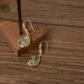 Gold Tone Shell Pattern Teardrop Hook Earrings In Black And White view 3