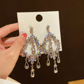 Iridescent Crystal Teardrop Earrings with Sparkling Stone Details view 3