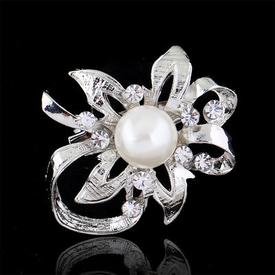 Front product view of the pearl crystal lily loop brooch pin in black and silver