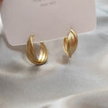 Matte Gold Triple Hoop Earrings with Sculpted Polished Metal Details view 3