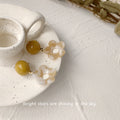 Mustard Yellow Round Stud Earrings Hollow Flower Drops view 3