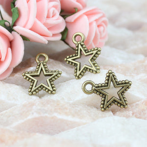 Open Center Five Point Star Alloy Charm in 4 Metal Finishes