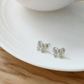 Mini Openwork Bow Stud Earrings In Gold And Silver Tone view 6