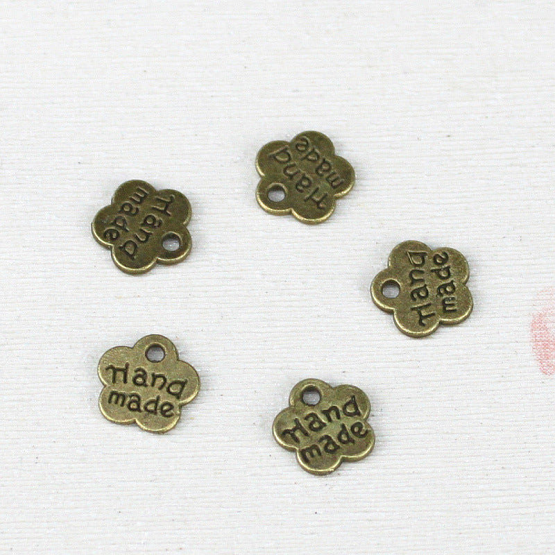 8mm Double-Sided Handmade Plum Blossom Alloy Charm