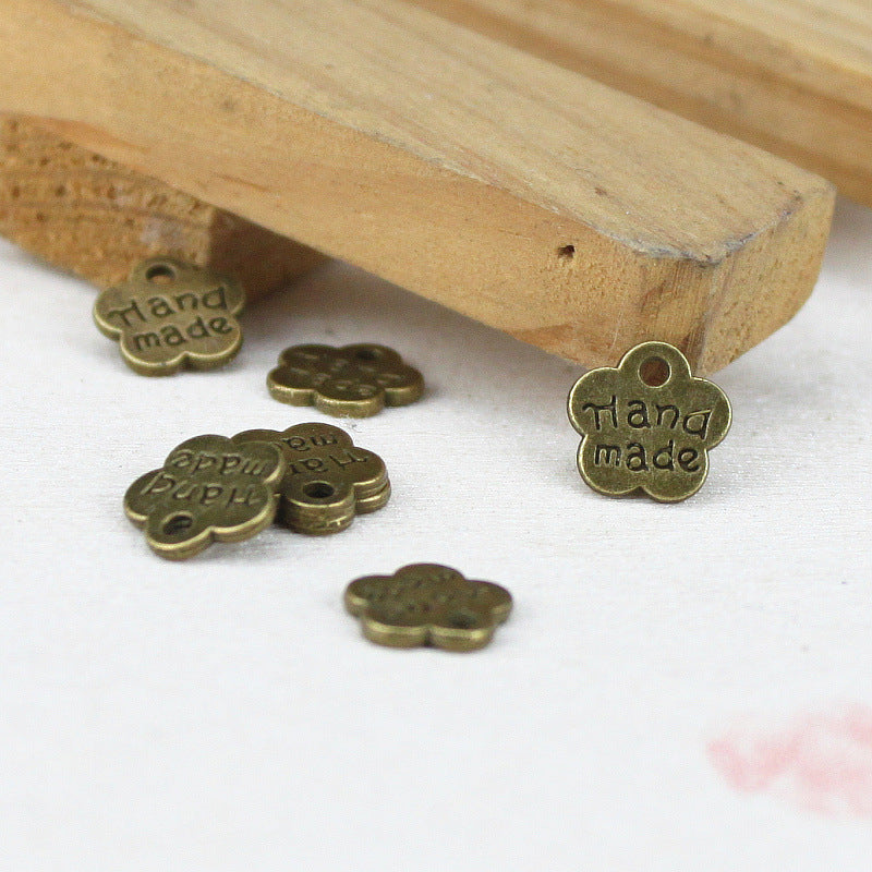 8mm Double-Sided Handmade Plum Blossom Alloy Charm