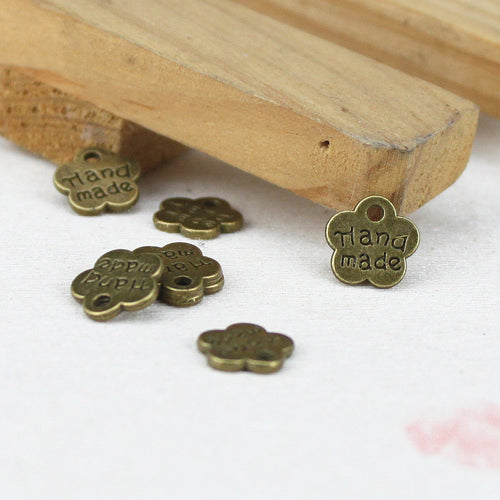 Group view of the handmade flower tag in pictured finishes