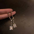 Geometric Crystal Drop Earrings with Sparkling Stone Details view 1