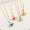 Gold Tone Rough Edge Eye-Shaped Glass Pendant Necklaces in Four Colors view 1