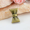 Bow-Shaped Large-Hole Slider Beads in Six Metal Finishes view 3