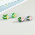 Oval Pressed Flower Resin Stud Earrings in Green or Pink view 3