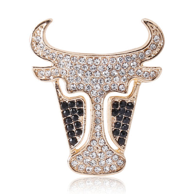 Gold crystal pave bull head brooch on white