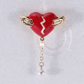 Hands Holding Broken Red Heart Brooch With Pearl Drop view 6