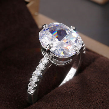 Silver Oval Clear CZ Four-Prong Solitaire Pavé Ring