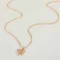 Gold Tone Crystal Butterfly Pendant Necklace and Huggie Earrings view 3