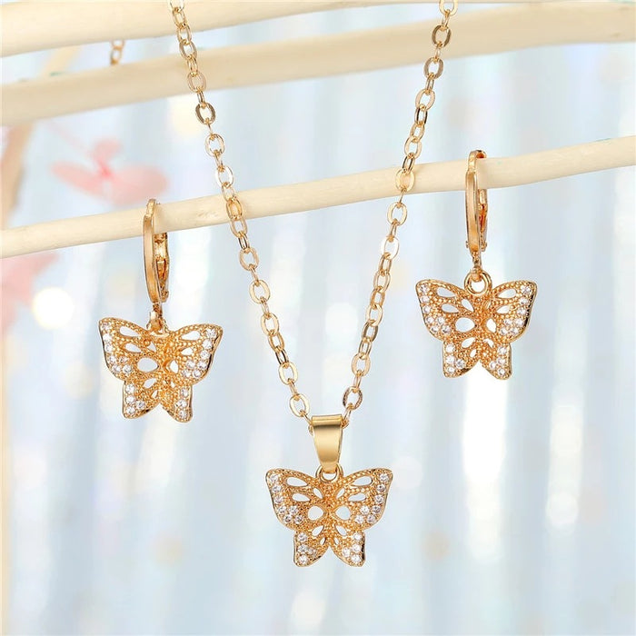 Gold Tone Crystal Butterfly Pendant Necklace and Huggie Earrings