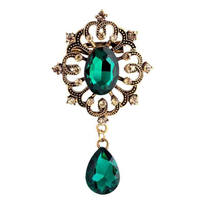 Front product view of the leaf brooch pin in gold and green
