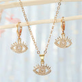 Gold Tone Crystal Evil Eye Pendant Necklace and Huggie Earrings view 4