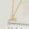 Gold Tone Crystal Whale Tail Pendant Necklace with Fine Chain view 2