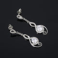 Silver Tone Swirl Drop Earrings with Clear Teardrop Stones view 3
