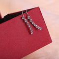 Curved Clear Look Star Row Hook Earrings in Two Finishes view 1