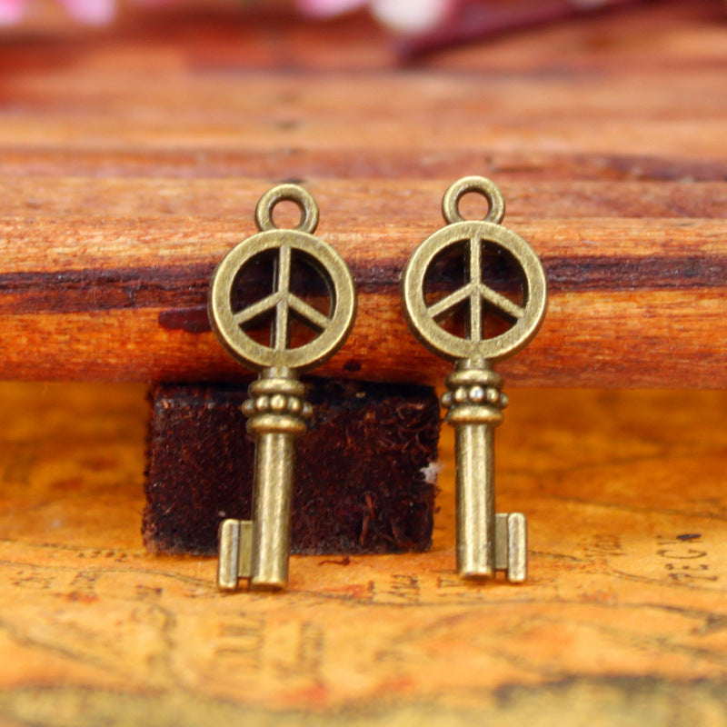 Vintage Double-Sided Peace Key Charm Pendant
