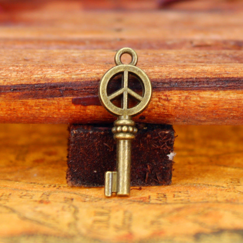 Vintage Double-Sided Peace Key Charm Pendant