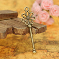 Daisy Bow Long Key Alloy Charm in 3 Metal Finishes view 2