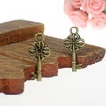 Four Petal Floral Skeleton Key Charms in Three Vintage Finishes view 3