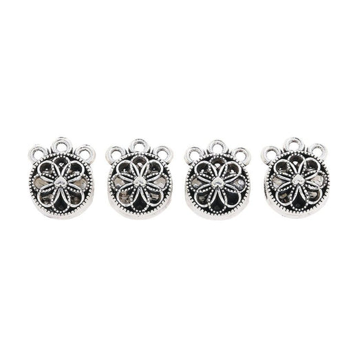 Round floral medallion bead with side openings and a top hanging loop shown in front detail view