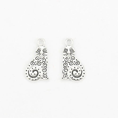 Front and reverse views of the filigree sitting cat charm