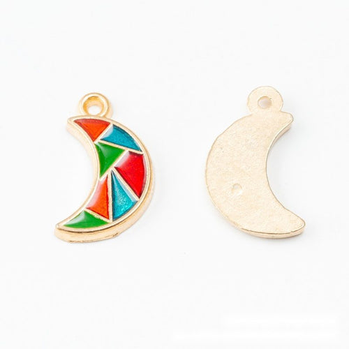 Closer view of the crescent moon with red, green, and turquoise enamel sections