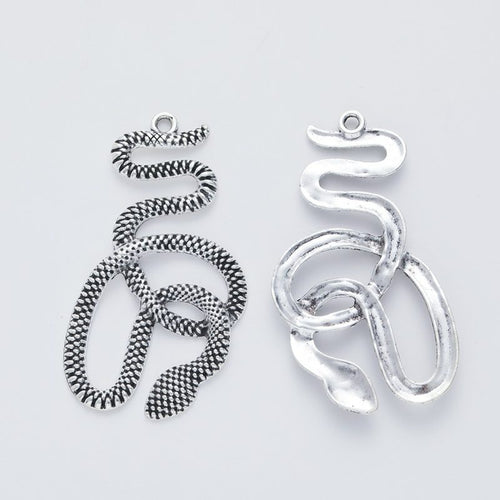 Alternate product view of coiled snake charms on a white background