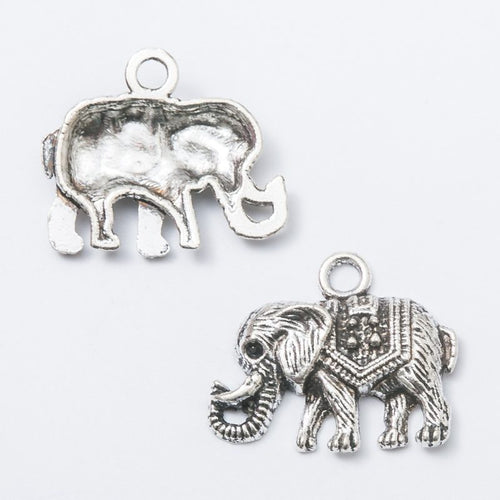 Ornate Elephant metal component, reverse and front details on a white background.