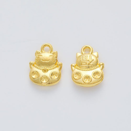 Close view showing the front and reverse details of the lucky cat charm with coin details