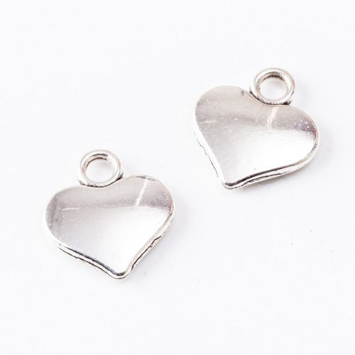 Small Smooth Heart Charm in an antique tone shown from the front