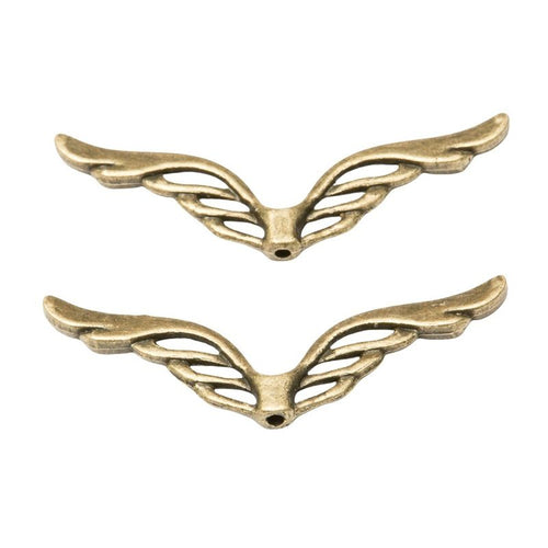 Close front view showing the shape and recessed details of the openwork angel wing spacer beads