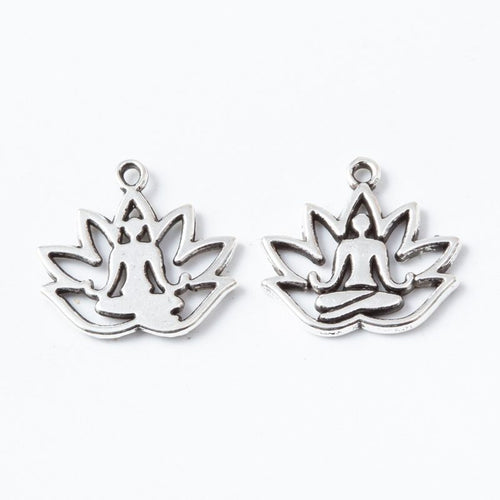 Product photo 2 of the yoga lotus charm highlighting its open lotus blossom with a seated figure at center