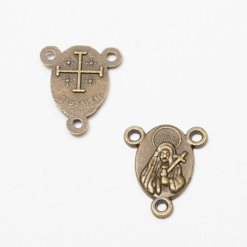 Detail view of religious medal connector showing finish variation 2