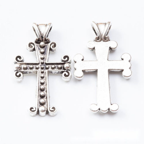 Alternate image of ornate cross pendant showing available finishes and form