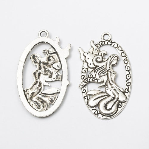 Additional front and reverse view of the oval angel charm