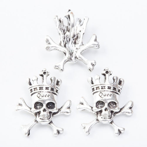 Front and reverse views of the crowned skull and crossbones in one finish