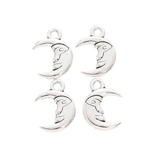 Grouped view of the crescent moon face metal charm from the front