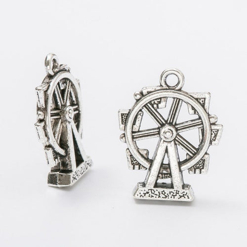Close product view showing the front and reverse details of the ferris wheel charm