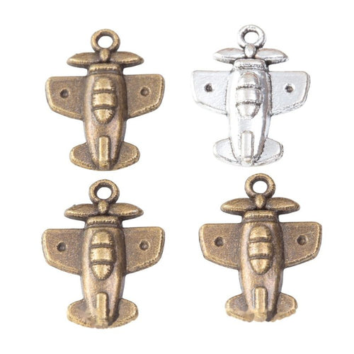 Close product view showing the front and reverse details of the small airplane charm