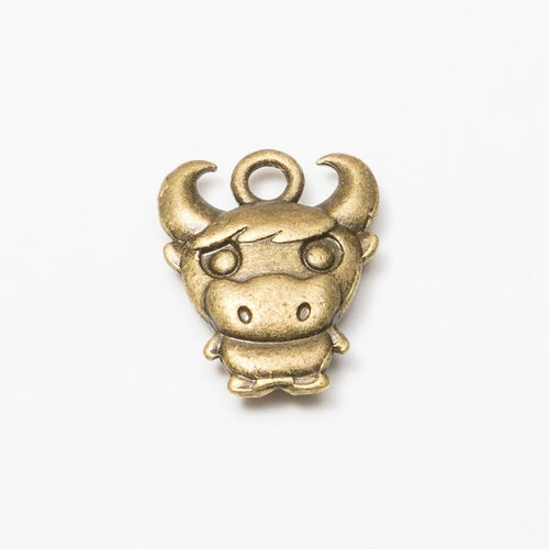 Cartoon Bull Head metal piece showing front-facing surface and relief detail