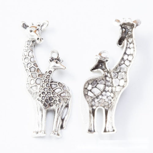 Close view showing the front and reverse details of the pair of giraffes charm