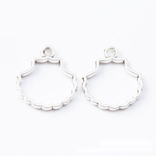 Scalloped Shell Resin Bezel shown from the front in contrasting finishes